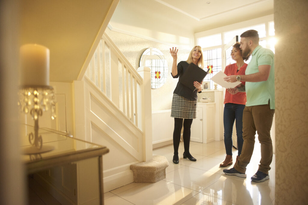 Couple with Realtor inside home