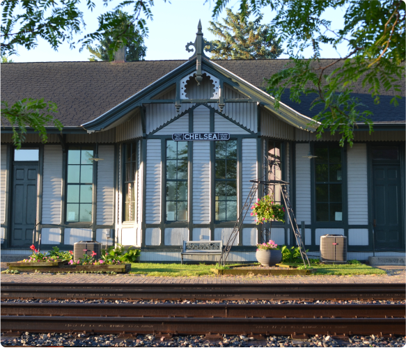 The front of Chelsea Station with train tracks in the foreground