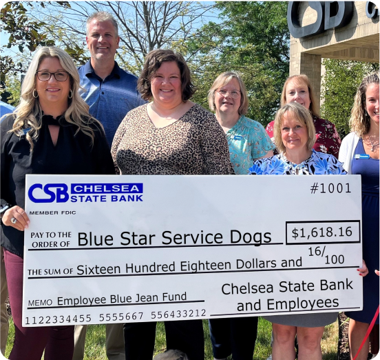 CSB Employees Holding Blue Star Service Dogs Check